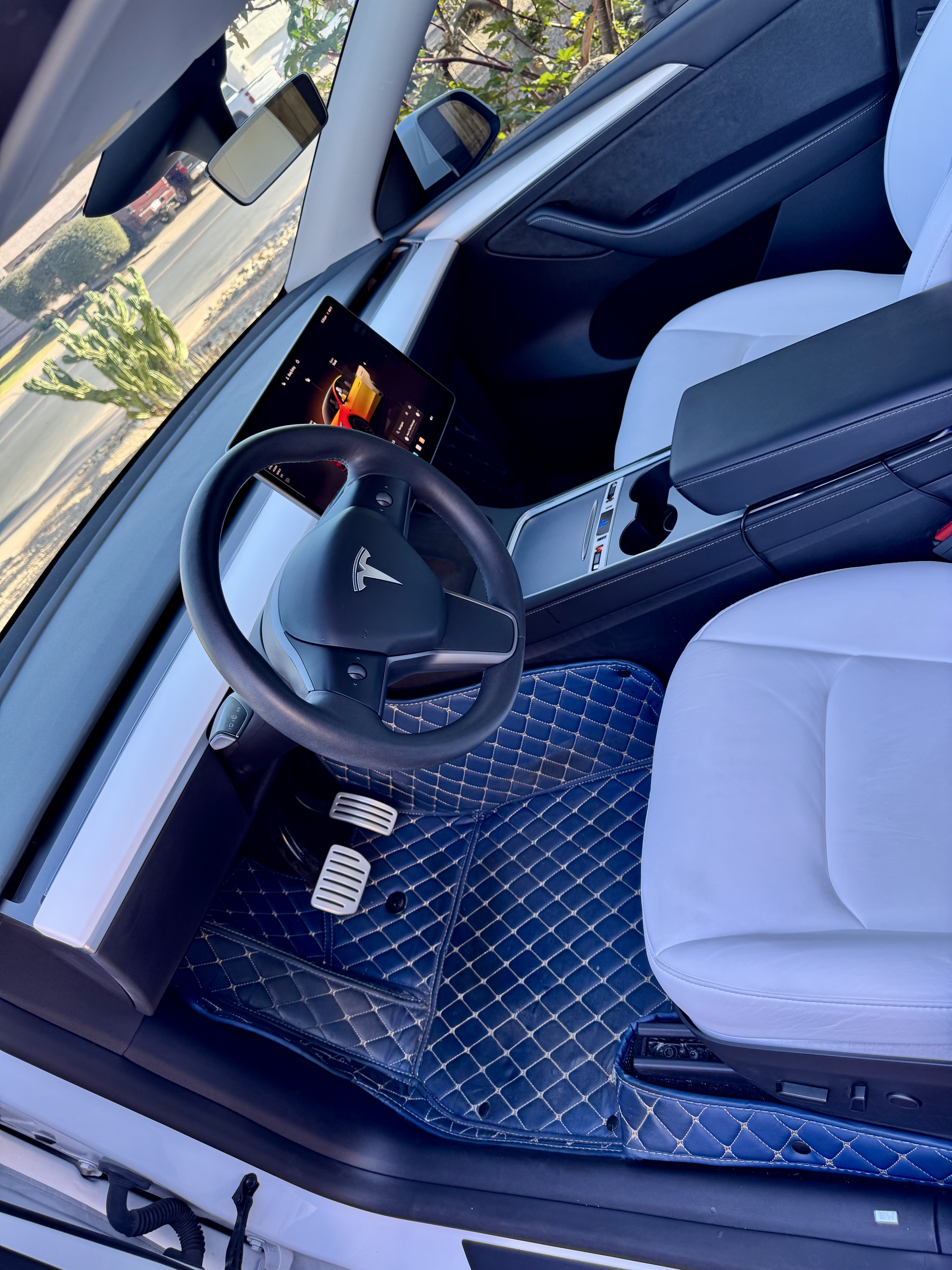 Tesla Model Y — navy quilted interior, white leather